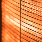 A close-up of heater coils glowing orange from being heated.